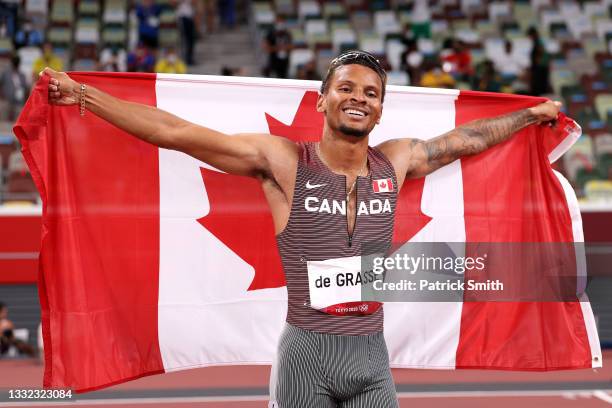 Andre De Grasse of Team Canada celebrates after winning the gold medal in the Men's 200m Final on day twelve of the Tokyo 2020 Olympic Games at...