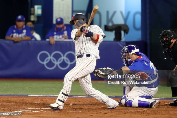 Tetsuto Yamada of Team Japan hits a three-run double in the eighth inning against Team Republic of Korea during the semifinals of men's baseball on...