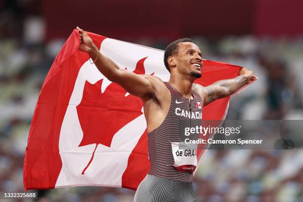 Andre De Grasse of Team Canada celebrates after winning the gold medal in the Men's 200m Final on day twelve of the Tokyo 2020 Olympic Games at...