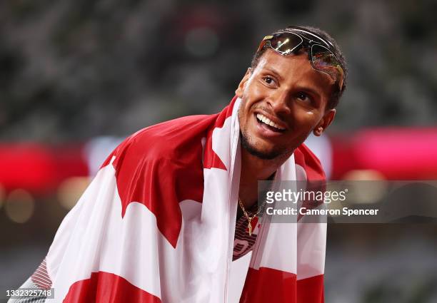 Andre De Grasse of Team Canada celebrates after winning the gold medal in the Men's 200m Final on day twelve of the Tokyo 2020 Olympic Games at...