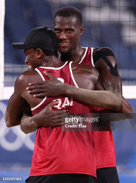 Cherif Younousse and Ahmed Tijan of Team Qatar react as they compete against Team Italy during the Men's Quarterfinal beach volleyball on day twelve...