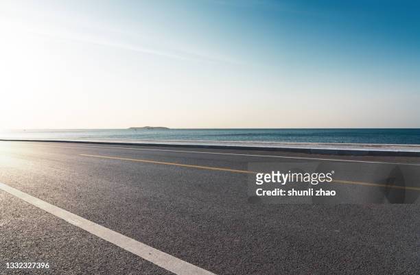 coastal road - empty road stock-fotos und bilder