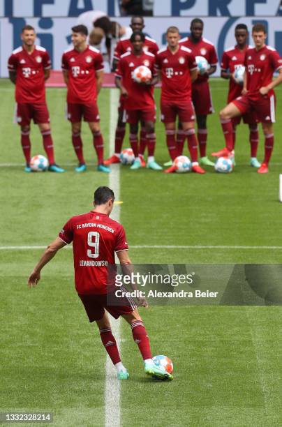 Robert Lewandowski of FC Bayern München kicks a ball during the team presentation at Allianz Arena on August 04, 2021 in Munich, Germany.