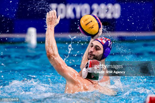 Denes Varga of Team Hungary, Paulo Obradovic of Team Croatia during the Tokyo 2020 Olympic Waterpolo Tournament Men Quarterfinal match between Team...