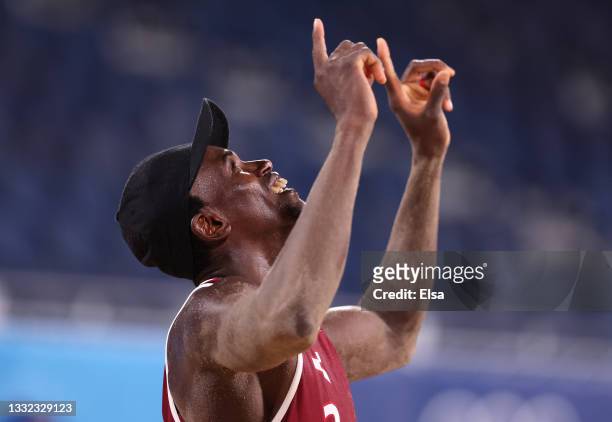Ahmed Tijan of Team Qatar reacts after defeating Team Italy during the Men's Quarterfinal beach volleyball on day twelve of the Tokyo 2020 Olympic...