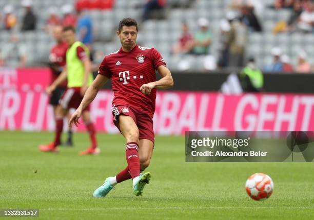 Robert Lewandowski of FC Bayern München kicks the ball during a training session at the team presentation at Allianz Arena on August 04, 2021 in...