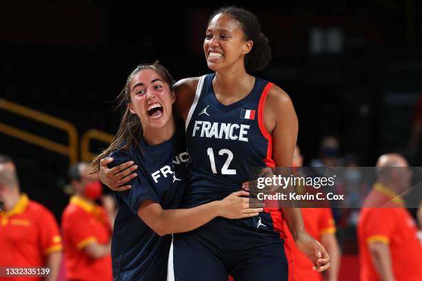 Iliana Rupert of Team France and Marine Fauthoux celebrate their victory over Team Spain in a Women's Basketball Quarterfinals game on day twelve of...