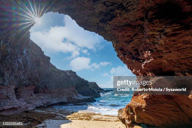 cave at playa de la solapa beach, fuerteventura - fuerteventura bildbanksfoton och bilder