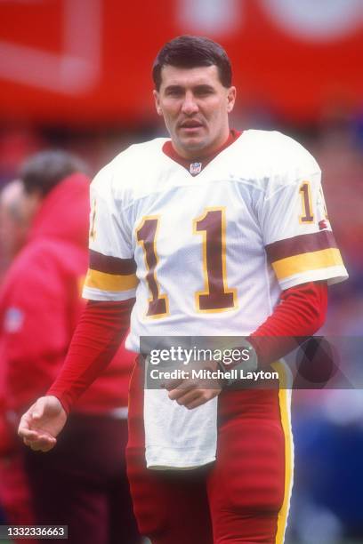 Mark Rypien of the Washington Redskins looks on before a NFL football game against the Dallas Cowboys on November 24, 1991 at RFK Stadium in...