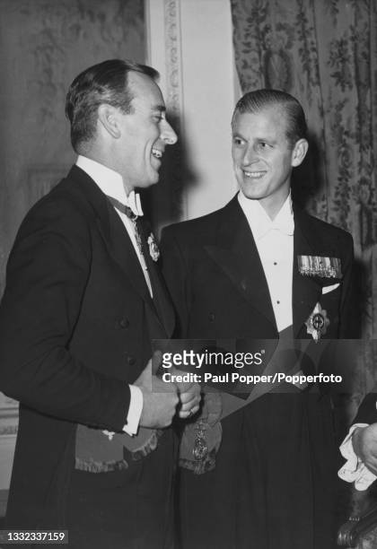 Louis Mountbatten, 1st Earl Mountbatten of Burma and his nephew Prince Philip, Duke of Edinburgh attend the National Playing Fields Association...