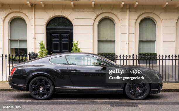 bentley continental gt on a london street - bentli stock pictures, royalty-free photos & images