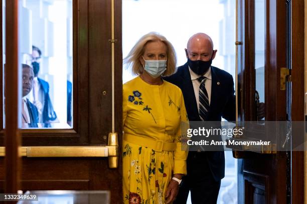 Cindy McCain, the wife of the late Sen. John McCain arrives with Sen. Mark Kelly at the Capitol Building on August 04, 2021 in Washington, DC. McCain...