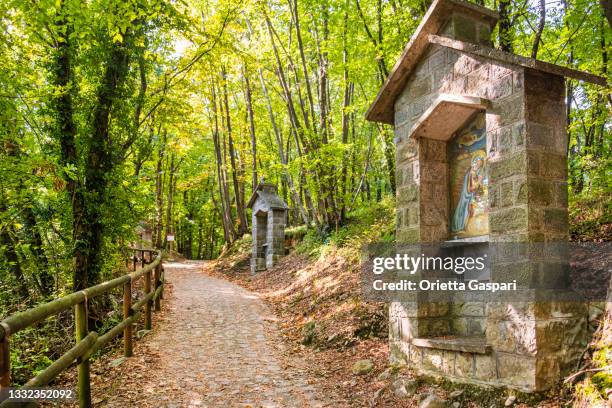 monte isola, stations of the cross (lake iseo, italy) - stations of the cross stock pictures, royalty-free photos & images