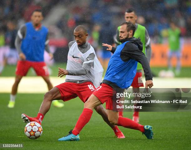 Antoine Bernede and Andreas Ulmer of FC Red Bull Salzburg warm up before the friendly match between FC Red Bull Salzburg and FC Barcelona at Red Bull...