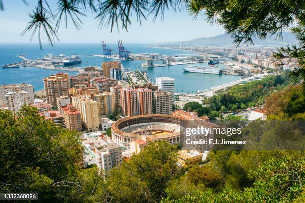 landscape of malaga with the bullring and the port - malaga province stock pictures, royalty-free photos & images