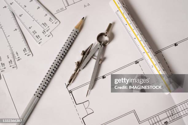 close-up of architect engineer drawing plan on blueprint with architect equipment - architectural designer stock pictures, royalty-free photos & images