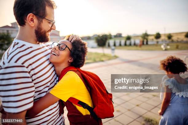 love of a father and daughter - first day school hug stock pictures, royalty-free photos & images