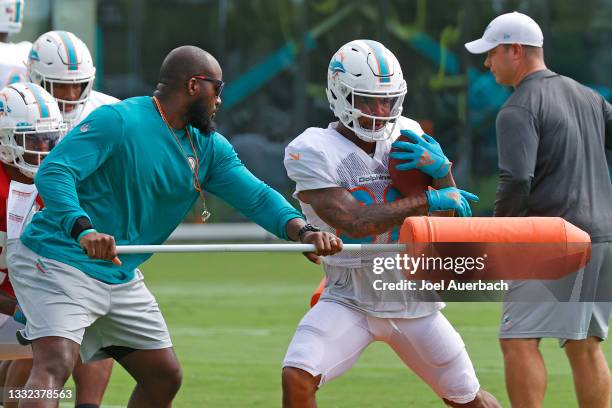 Myles Gaskin of the Miami Dolphins runs a drill during the training camp at the Baptist Health Training Complex on August 4, 2021 in Miami Gardens,...