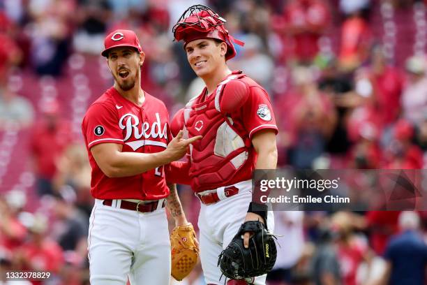 Michael Lorenzen celebrates with Tyler Stephenson of the Cincinnati Reds after a 6-5 win over the Minnesota Twins during their game at Great American...