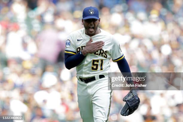 Freddy Peralta of the Milwaukee Brewers pounds his chest after getting out of a jam in the sixth inning against the Pittsburgh Pirates at American...