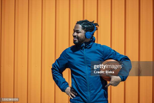 portrait of a street basket player - pick up basketball stock pictures, royalty-free photos & images