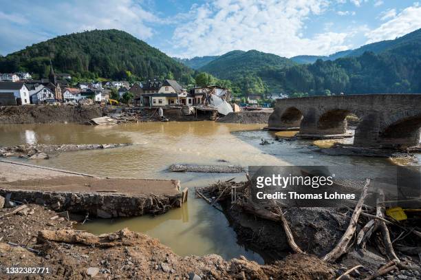 Destroyed houses, roads and a bridge pictured during ongoing cleanup efforts in the Ahr Valley region following catastrophic flash floods on August...