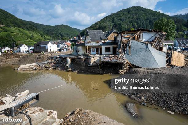 Destroyed houses, roads and a bridge pictured during ongoing cleanup efforts in the Ahr Valley region following catastrophic flash floods on August...