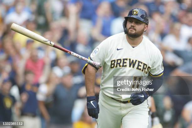 Rowdy Tellez of the Milwaukee Brewers flips his bat in front of the Brewers dugout after hitting a three run homer in the seventh inning against the...