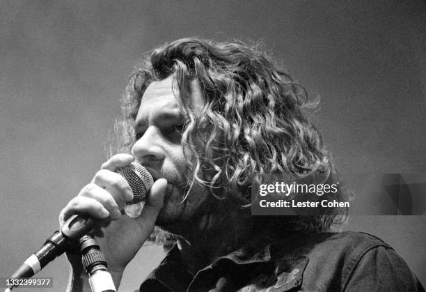 Australian musician, singer-songwriter and actor Michael Hutchence , of the Australian rock band INXS, sings on stage during the 1993 Get Out Of The...