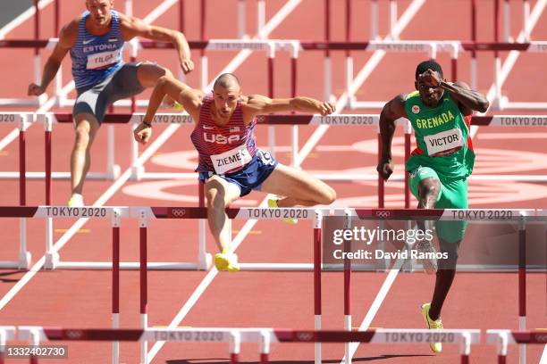 Karel Tilga of Team Estonia, Zachery Ziemek of Team United States and Lindon Victor of Team Grenada compete in the Men's Decathlon 110m Hurdles heats...