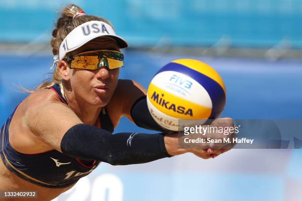 April Ross of Team United States dives for the ball against Team Switzerland during the Women's Semifinal beach volleyball on day thirteen of the...