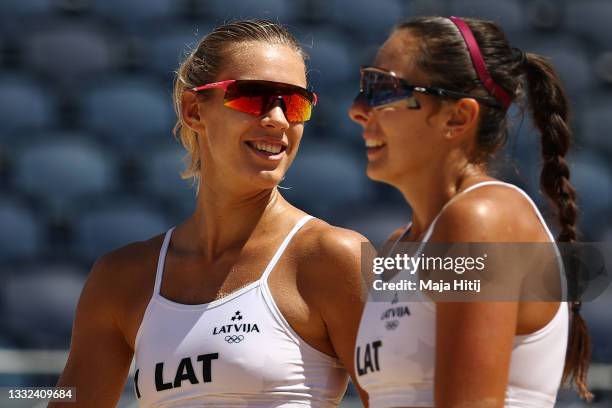 Tina Graudina of Team Latvia celebrates with Anastasija Kravcenoka after the play against Team Australia during the Women's Semifinal beach...