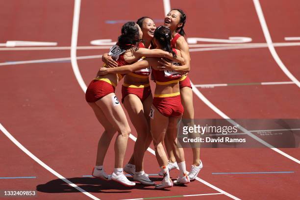 Yongli Wei, Guifen Huang, Manqi Ge and Xiaojing Liang of Team China celebrate after coming in third in round one of the Women's 4 x 100m Relay Heat 2...