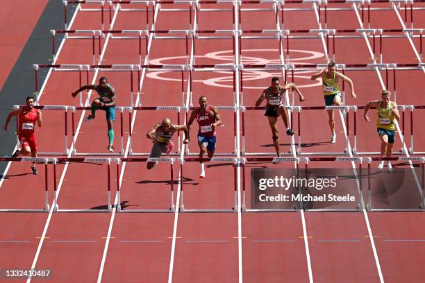 Damian Warner of Team Canada leads in the Men's Decathlon 110m Hurdles heats on day thirteen of the Tokyo 2020 Olympic Games at Olympic Stadium on...