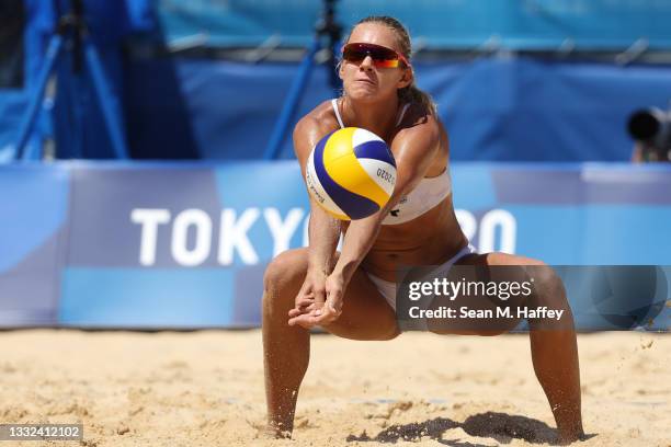 Tina Graudina of Team Latvia returns the ball against Team Australia during the Women's Semifinal beach volleyball on day thirteen of the Tokyo 2020...