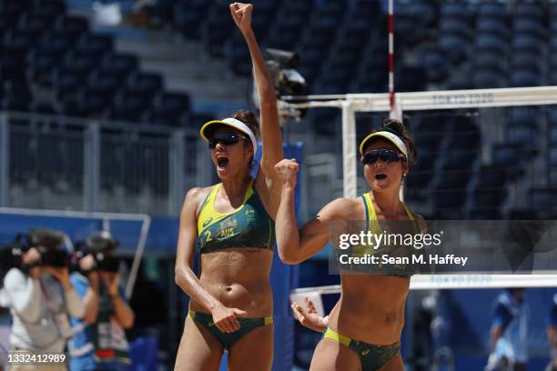 Mariafe Artacho del Solar of Team Australia and Taliqua Clancy celebrate after defeating Team Latvia during the Women's Semifinal beach volleyball on...