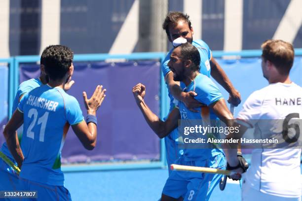 Hardik Singh of Team India celebrates scoring their second goal with teammates during the Men's Bronze medal match between Germany and India on day...