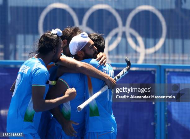 Simranjeet Singh of Team India celebrates scoring their fifth goal with teammates during the Men's Bronze medal match between Germany and India on...
