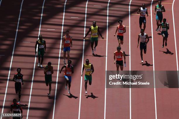 Athletes compete in round one of the Men's 4 x 100m Relay heats on day thirteen of the Tokyo 2020 Olympic Games at Olympic Stadium on August 05, 2021...
