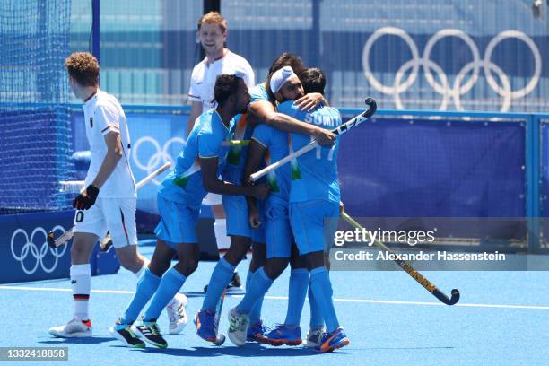 Simranjeet Singh of Team India celebrates scoring their fifth goal with teammates during the Men's Bronze medal match between Germany and India on...