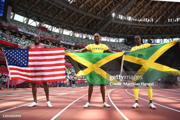 Silver medalist Grant Holloway of Team United States, gold medalist Hansle Parchment of Team Jamaica and bronze medalist Ronald Levy of Team Jamaica...