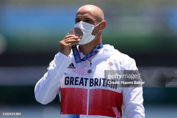 Bronze medalist Liam Heath of Team Great Britain celebrates at the medal ceremony following the Men's Kayak Single 200m Final A on day thirteen of...