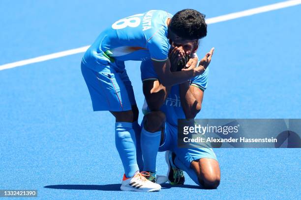 Nilakanta Sharma and Hardik Singh of Team India celebrate after winning the Men's Bronze medal match between Germany and India on day thirteen of the...