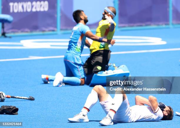 Sreejesh Parattu Raveendran of Team India celebrates after winning while Lukas Windfeder of Team Germany reacts following the Men's Bronze medal...