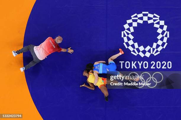 Joseph Emilienne Essombe Tiako of Team Cameroon competes against Mayu Mukaida of Team Japan during the Women's Freestyle 53kg 1/8 Final on day...