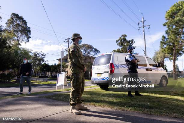 Police and Military are seen at the pop-up walk-in clinic at the Michael Wenden Aquatic Leisure Centre in Miller on August 05, 2021 in Sydney,...