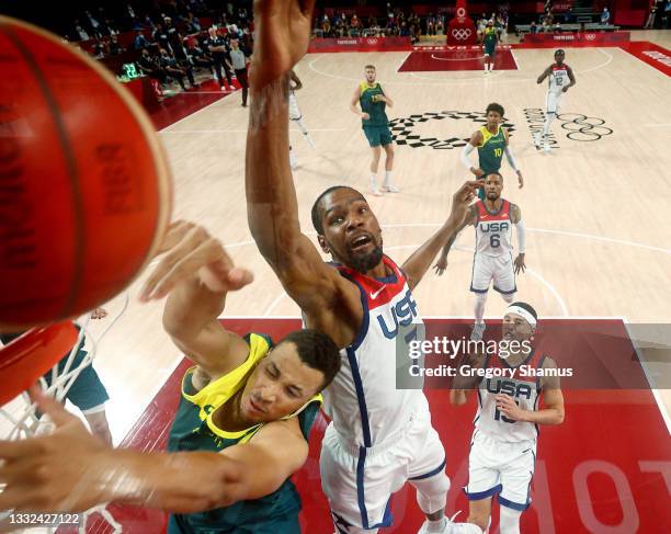 Dante Exum of Team Australia goes up for a shot against Kevin Durant of Team United States during the first half of a Men's Basketball quarterfinals...
