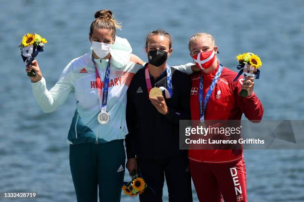 Silver medalist Tamara Csipes of Team Hungary, gold medalist Lisa Carrington of Team New Zealand and bronze medalist Emma Aastrand Jorgensen of Team...