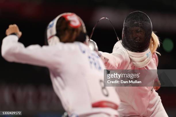 Marie Oteiza of Team France and Samantha Schultz of Team United States compete during the Fencing Ranked Round of the Women's Modern Pentathlon on...