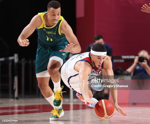 Devin Booker of Team United States dives for a loose ball against Team Australi during the first half of a Men's Basketball quarterfinals game on day...